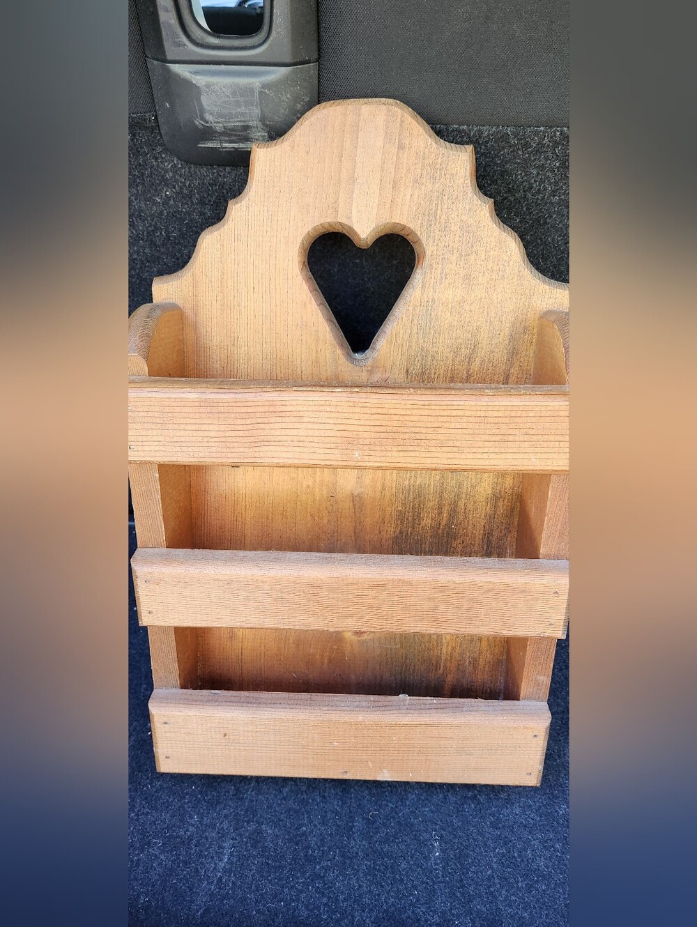 Vintage wooden wall-mounted mail or magazine holder With heart cutout .